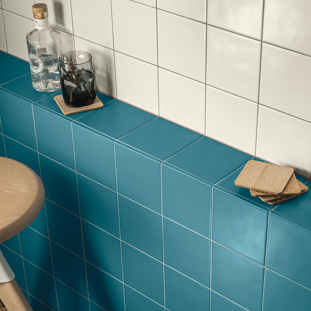 Pastello flisen i farven Off White og Misty Blue