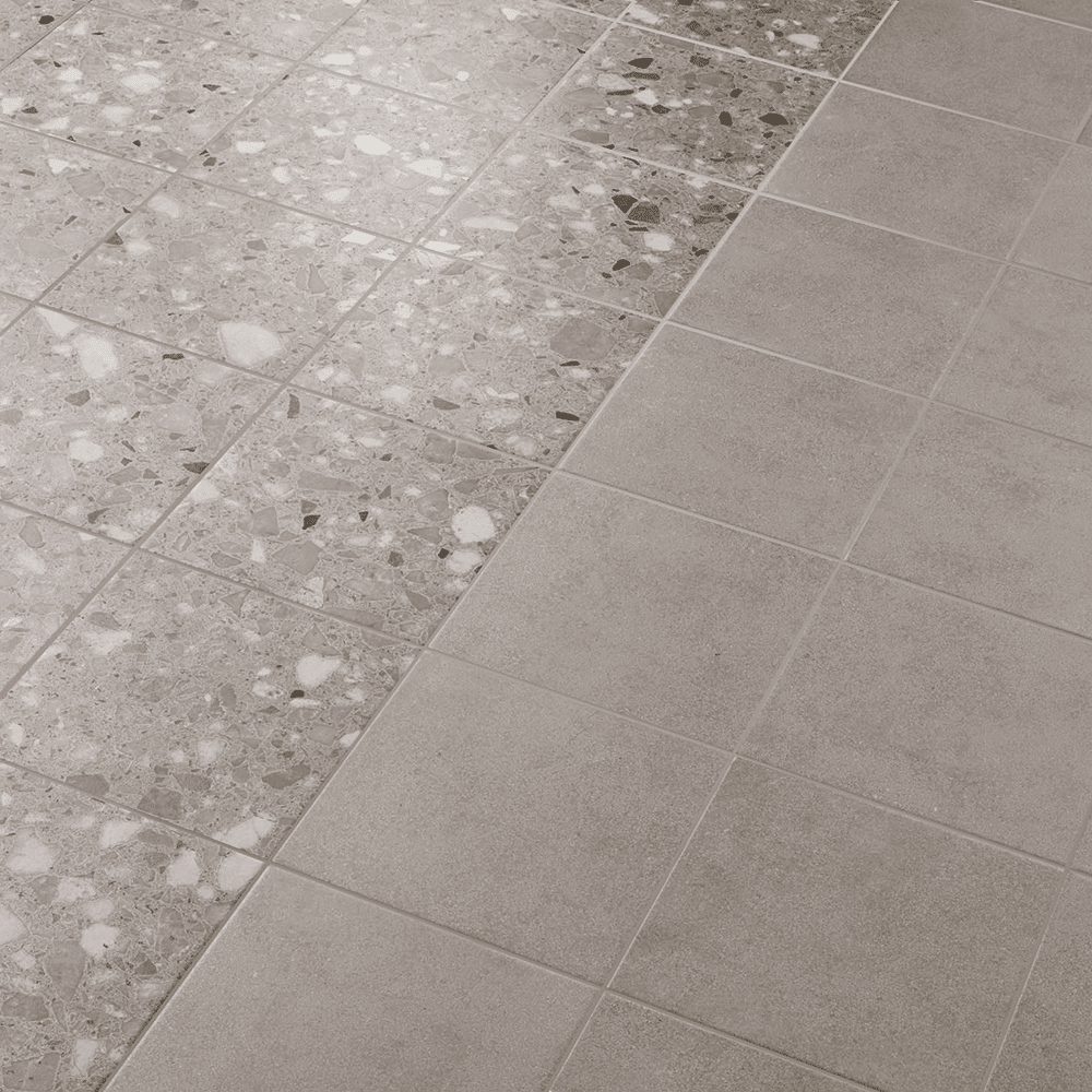 Andy flisen i farven Grey med Plain og Terrazzo overflade